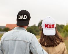 Pregnancy Announcement Hats.Mom and Dad Hats Set of 2Details: Includes 1 - Dad Hat * 100% cotton * one size Includes 1 - Mom Hat * 100% cotton * one size Personalized White Cotton Hat, White Personalized Cotton Hat, Personalized Cotton Hat With Curved Brim, Personalized Cotton Hats With Curved Brim, Casual Curved Brim Baseball Cap For Mother's Day, Cotton Trucker Hat With Curved Bill As Gift, Father's Day Cotton Hat With Curved Bill, Casual Curved Bill Hat For Mother's Day, White Cap For Mother's Day