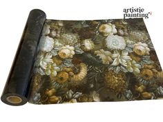 an artistic painting with flowers and leaves on the wall next to a roll of black paper