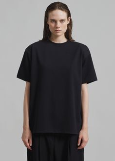 Color: Black Soft cotton jersey Boxy fit Crew neckline Straight hem Slip on style Unlined 51% Polyester 42% Cotton 7% Elastane Machine Wash Cold By The Frankie Shop. Imported Denim Suit, Paris Woman, Ny City, Leather Texture, Unisex Gifts, Swimwear Accessories, Black Tee, Jumpsuit Dress, Slip On