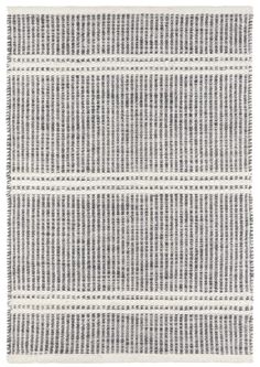 a gray and white rug with lines on the bottom, in two different colors that appear to be woven