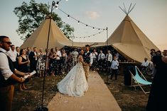 a bride and groom walk down the aisle as confetti is thrown around them