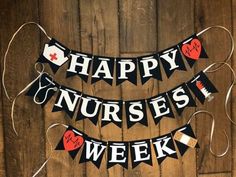 a happy nurses week banner hanging on a wooden wall