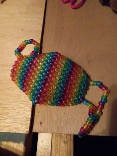 A typical face mask that is made entirely out of Kandi beads.  (If worn out, please wear a regular cloth mask underneath for safety) Rainbow Kandi, Kandi Mask, Kandi Beads, Cloth Mask, Kandy, Face Masks, Etsy App, Selling On Etsy, Beauty And Personal Care