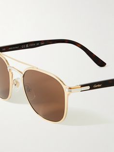 A modern interpretation of the traditional aviator style, Cartier Eyewear's sunglasses have been crafted in France from gold-tone metal and accented with silver-tone details and comfortable tortoiseshell acetate temples. They have an arched nose bridge and classic brown lenses. Cartier Gold, Aviator Style, Optical Glasses, Gold Sunglasses, Eye Wear Glasses, Tortoise Shell, Eyewear Sunglasses, Gold Tone Metal, Cartier