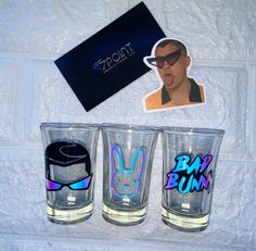 FOR MORE BAD BUNNY ITEMS FOLLOW THE LINK BELOW https://www.etsy.com/shop/5pointproductions?ref=search_shop_redirect 🚨 PLEASE READ CAREFULLY Set of 3 Bad Bunny shot glasses. Perfect El Conejo Malo gift for a Bad Bunny fan. Collect all six and create your own Bad Bunny Drinking game. Care Instructions: ✔️Hand wash only 🚫Do not Scrub or soak 🚫Do not microwave, or leave in hot car ✔️Intended for cold beverages only 🚨🚨Our shop begins processing items shortly after an order is placed. Therefore, Bad Bunny Birthday, Bunny Items, Bunny Backpack, Bunny Blanket, Bunny Hoodie, Bunny Slippers, Bunny Birthday, Drinking Game, Bunny Gifts