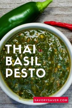 thai basil pesto in a white bowl next to peppers