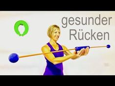 a woman is hitting a blue ball with a wooden stick in front of her and the words gesunder rucken on it