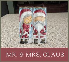 an image of two santa clauss painted on the side of a canister with words mr and mrs claus