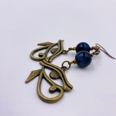 2 1/2 Inch Total Length 10MM Genuine Blue Tiger Eye Gemstones 2x1 Inch Eye of Heru Charms - Bronze Blue Spiritual Earrings For Gifts, Blue Brass Jewelry With Ear Wire, Blue Spiritual Dangle Earrings, Blue Spiritual Metal Jewelry, Spiritual Blue Dangle Earrings, Spiritual Blue Jewelry With Ear Wire, Blue Spiritual Nickel-free Earrings, Blue Hypoallergenic Metal Jewelry, Egyptian Earrings