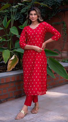 Bring on the festive spirit with our kurta set in hand embroidered chanderi silk. Fully lined kurta and pants. Made in chanderi silk. Dupatta in mul cotton with gold tikki details. Color of Kurta + Pants : Red. Color of Dupatta : Purple. Model height is 5.6” and is wearing a size S. Wash Care : Dry Clean Only. Festive Sets With Zari Work On Straight Kurta, Diwali Straight Kurta Palazzo Set With Gota Work, Eid Palazzo Set With Straight Kurta In Chanderi, Diwali Palazzo Set With Gota Work On Straight Kurta, Festive Resham Embroidered Mulmul Palazzo Set, Eid Festive Straight Kurta Salwar Kameez, Red Chanderi Straight Kurta, Festive Slub Silk Kurta With Chikankari Embroidery, Festive Chanderi Palazzo Set For Transitional Season