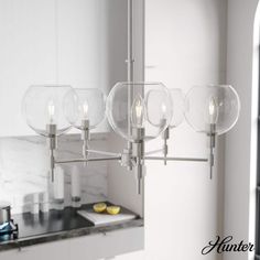 a light fixture hanging from the ceiling in a kitchen