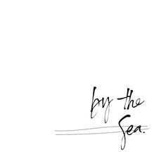 the word by the sea written in black ink