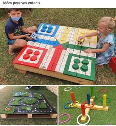 two children playing with wooden toys in the grass and one child sitting on the ground