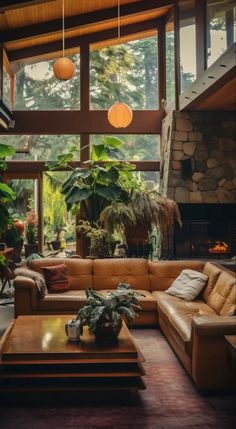 a living room filled with lots of furniture and plants on top of it's walls