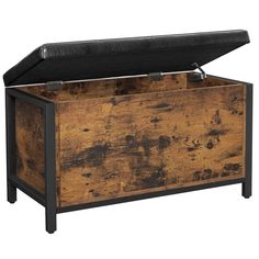 an old trunk is shown with the lid open and it's black metal frame