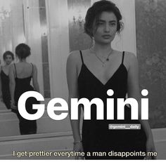 a woman standing in front of a mirror with the words gemini on it