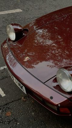 a red sports car parked in a parking lot