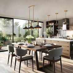 a dining room table and chairs in front of an open kitchen with sliding glass doors