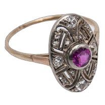 A former Art Deco ring from the 1920s.  Made of 0.585 yellow gold and 0.990 silver.  Central natural pink ruby weighing 0.40ct surrounded by diamonds with a total weight of 0.25ct (SI-VS)  Preserved hallmark for Hungary in the 1920s.  Item weight: 2.17g  Size: 15 - correction possible Antique Ruby Rings With Single Cut Diamonds, Vintage Diamond Ruby Ring, Vintage Ruby Rings With Single Cut Diamonds, Antique Ruby Diamond Ring Hallmarked, Vintage 14k Gold Ruby Ring With Diamonds, Vintage 14k Gold Ruby Ring With Single Cut Diamonds, Antique Style Brilliant Cut Yellow Gold Ruby Ring, Antique Yellow Gold Ruby Ring With Brilliant Cut, Vintage Pink Diamond Ring Hallmarked