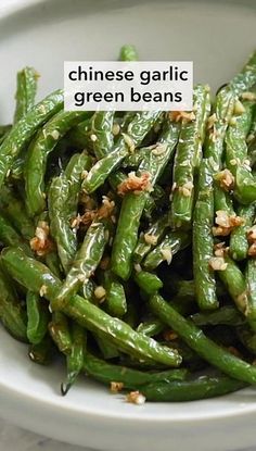 chinese garlic green beans in a white bowl