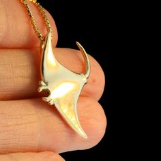 "Glide into intoxicating turquoise oceans wearing this sleek 14k Gold Manta Ray Charm. The charm is carefully detailed and completely three dimensional and solid. Manta's pectoral wing span is 1.25\" across and it is .75\" long (32 x 19mm). This item usually ships the same or next business day. All Marty Magic Jewelry is packaged in a beautiful box, embossed with the gold foil Marty Magic dragon logo. Perfect for any occasion! Designed in Santa Cruz California by Marty Magic. Made in the U.S.A." Luxury Untreated Jewelry For Gift, Luxury Untreated Jewelry As A Gift, Unique Untreated Yellow Gold Jewelry, Elegant Untreated Pendant Jewelry, Untreated Fine Jewelry Gift, Untreated White Gold Jewelry Gift, Gold Untreated Jewelry As A Gift, Stingray Jewelry, Stingray Pendant