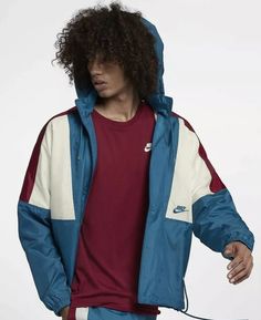 This Nike Sportswear 1989 Retro Windbreaker Jacket is the perfect addition to any wardrobe. Made with polyester fabric and a mesh lining, it is perfect for summer, fall, and spring. The jacket features a stand-up collar, long sleeves, and a mid-length coat style. It has a colorblock pattern of blue, red, and sail, giving it a unique look. This limited edition Nike jacket is perfect for athleisure and activewear occasions. It has a relaxed fit and elastic waist for added comfort. It also has inner pockets, removable hood, and pockets for storing your essentials. This jacket is part of the Nike 89 Jacket product line and is a must-have for any fan of Kith, Concepts, Air Max, Windbreaker, 80s, Retro, and Dunk themes. Windbreaker Jacket Outfit Men, Nike Long Sleeve Sport Coat For Outdoor, Nike Casual Long Sleeve Sport Coat, Nike Casual Winter Sport Coat, Casual Nike Sport Coat With Long Sleeves, Retro Long Sleeve Track Jacket For Winter, Throwback Outdoor Outerwear For Fall, Nike Fall Windbreaker For Streetwear, Nike Hooded Sport Coat For Fall