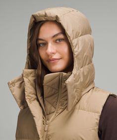 This Wonderfully Warm Down Puffer Has A Cinchable Waist And Hem That Lets You Customize The Shape And Keep Out Cold Drafts. Designed For Casual. Relaxed Fit Feels Roomy And Can Be Worn Over Larger Layers. Size Down If You Prefer A Slimmer Fit. Zippered Exterior Pockets With A Hidden Phone Sleeve. Interior Pockets Hold The Essentials. Removable Hood. Cinch The Interior Waist And Hem Drawcord To Customize Your Fit. | Wunder Puff 600-Down-Fill Mid-Length Vest Warm Down, Women's Coats & Jackets, Women's Coats, Womens Vest, Mid Length, Repellent, Water Repellent, Coats For Women, Puffer