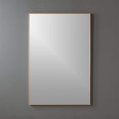 a square mirror hanging on the wall