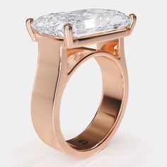 a rose gold ring with a large diamond in the center