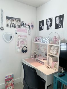 a room with a desk, chair and pictures on the wall above it that says hello kitty