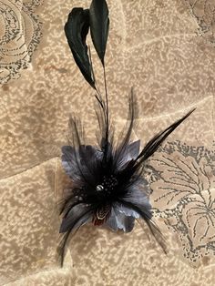 Retro charm.  Your choice: Black or Gray/Black Silk Flower Sprout with crystals & feathers Hair Clip brooch pin hair clip. Has metal Alligator clip and brooch pin on back.  Will ship worldwide. Elegant Black Feather Hair Accessories, Elegant Black Hair Accessories With Feathers, Black Feather Hair Accessories For Party, Black Feathered Hair Accessories For Party, Black Flower Brooch For Party, Elegant Black Hair Accessories For Gift, Feather Hair Clips, Pin Hair, Feather Fascinators