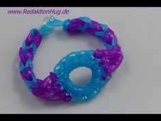 a purple and blue bracelet on a white surface