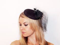 Look STUNNING anywhere you go in this timeless black fascinator hat. This hat is 6 inches wide, with a 7 inch veil (approximately.) This fascinator is topped off with 4 black flowers, dazzling black beading and a net veil. 2 silver barrette clips attach the hat easily to the head and keep it in place. Works for all hair styles - this piece is elegant, classy and perfect for any occasion! All of our items are handmade by a member of our shop. Our crowns, tiaras and jewelry are made of a thicker p Fitted Cap Mini Hat For Wedding, Black Flat Cap For Party, Fitted Cap Fascinator For Party, Fitted Party Cap Fascinator, Black Felt Hat For Kentucky Derby Party, Adjustable Flat Cap For Parties, Adjustable Flat Cap Mini Hats For Party, Fitted Mini Party Cap, Fitted Mini Cap For Party