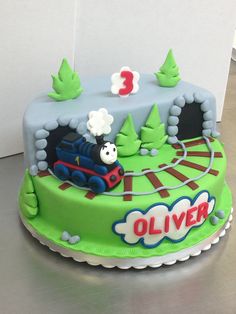 a thomas the train birthday cake on a table