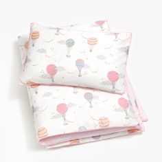 two pillow cases with hot air balloons on them