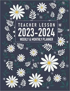 the teacher lesson book with white daisies and green leaves on a dark blue background