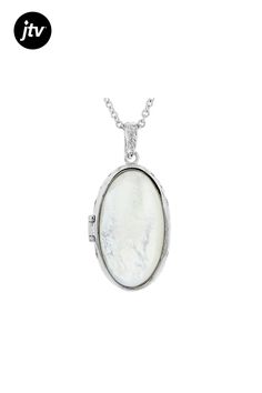 Paula Deen Jewelry 34x19mm oval white mother-of-pearl rhodium over brass locket enhancer with 18" chain. Measures approximately 1.94"L x 0.95"W. Lobster clasp. 2" extender. Elegant Oval Link Locket Necklace, Elegant Oval Link Keepsake Necklace, Elegant Oval Link Necklace For Keepsake, White Gold Oval Pearl Drop Jewelry, Classic White Oval Pendant Jewelry, Classic Oval Nickel-free Necklace, White Oval Pendant With Polished Finish, Classic Oval Pearl Pendant Jewelry, Oval Mother Of Pearl Jewelry With Polished Finish