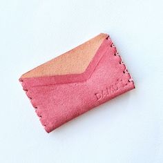 This stylish and comfortable credit card case is 100% handmade with no machine support, using high-quality Portuguese suede.  - Colour beige, pink - Width 10 cm  - Height 6 cm  - Thickness 0,8 cm - 4 card slots and 1 middle pocket Before DAMU*oL card holder reaches you, it will be treated with special suede spray. If it starts to feel dry and brittle, treat it with neutral suede spray. It will last longer.  Please, always remember, that suede is natural material and it changes over the time. It Luxury Elegant Pink Card Holder, Everyday Envelope Card Holder With Card Slots, Pink Leather Card Holder With Card Slots, Envelope Card Holder With Card Slots For Daily Use, Envelope Shaped Card Holder With Card Slots, Pink Leather Card Holder For Daily Use, Pink Card Holder With Card Slots As Gift, Pink Card Holder With Interior Slots As Gift, Everyday Red Card Holder With Card Slots