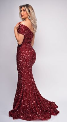 Sequin bodice Back zipper closure Off shoulder Model wearing size Small Red One Shoulder Gown For Prom, One-shoulder Fitted Evening Dress For Red Carpet, Fitted One-shoulder Evening Dress For Red Carpet, Red One-shoulder Gown For Prom, Red Fitted One-shoulder Dress, One-shoulder Sequin Dress With Fitted Bodice, Red Sequin Dress With Fitted Bodice, Red Fitted Evening Dress With Asymmetrical Neckline, Red Fitted One-shoulder Gown