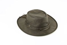 Our smooth leather cowboy hats are made of genuine cowhide leather. This beautifully handcrafted hat is made with fine craftsmanship and materials. Any scars, wrinkles or other subtle variations are characteristics of natural leather and do not affect its strength or quality. The unisex leather hat is embellished with brass conchos. The crown of the had also boasts a braided hat band. Use the strap for windy days or to keep it around your neck while traveling so you won't lose it.  Another great Brown Braided Hat For Rodeo, Leather Hat Bands For Ranch In Summer, Leather Hat Bands For Summer Ranch, Leather Hat Bands For Summer Ranch Events, Western Fedora With Braided Flat Brim, Wide Brim Leather Hats For Country Events, Leather Hat Bands For Ranch, Leather Hats For Summer Country Events, Western Braided Hat Band With Flat Brim