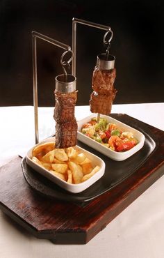 two trays filled with different types of food