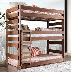 a wooden bunk bed sitting on top of a hard wood floor next to a window