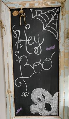 a chalk board with halloween writing on it