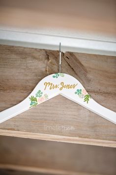 a wooden hanger with the name mrs jones on it