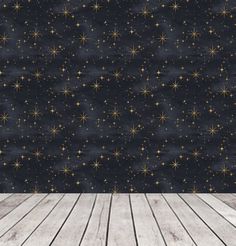 an empty room with wooden floors and stars on the wall