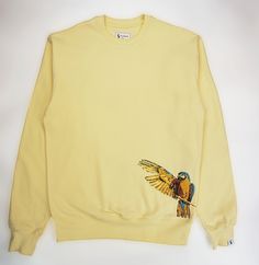 Completely embroidered Blue Macaw in an abstract style on a sweater in Butter Yellow. Brushed Pure Organic Cotton 300GSM  which is a very luxurious feel - not your cheap quality sweaters! DELIVERY All items will be delivered within 5 working days. Harajuku style and Japanese art inspired design. We also have Japanese streetwear hoodies on sale! Everything we sell is from anime inspiration which enabled us to create anime shirts, anime hoodies, styled in japanese clothing. Thank you for checking our shop! Blue Macaw Parrot, Quality Sweaters, Anime Inspiration, Blue Macaw, Anime Shirts, Japanese Clothing, Macaw Parrot, Heavy Sweaters, Harajuku Style