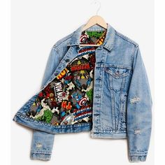 a denim jacket with cartoon characters on it