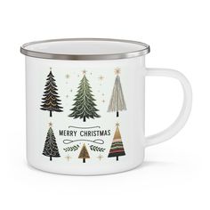 a white enamel mug with christmas trees on it