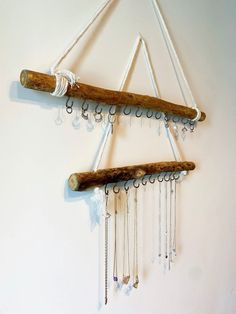 a wind chime hanging from the side of a wall