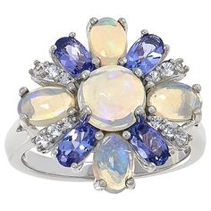 Colleen Lopez Multi-Gemstone Flower Ring  Let your style bloom with this sterling silver flower ring, featuring pretty "petals" crafted from your choice of gemstones. It's the perfect way to add whimsical, nature-inspired beauty to your look.       Approx. 11/16"L x 3/4"W x 5/16"H; shank 1/16"W     Stamped .925 sterling silver     Rhodium (Opal) or gold (Turquoise) plating   Stone Information       All sizes and weights approximate     Total Carat Weight: 0.94ct (Kingman Turquoise/Aquamarine) or Whimsical Nature, Silver Flower Ring, Color Bands, Kingman Turquoise, Sterling Silver Flowers, Flower Ring, Silver Flowers, Ethiopian Opal, Nature Inspired